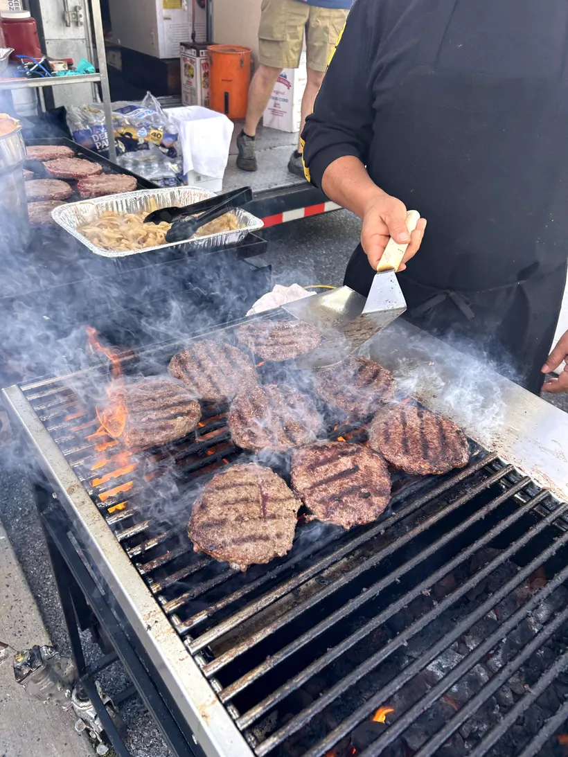 A vendor crew grilling burgers at the Taste of Hamburg-er Festival.
